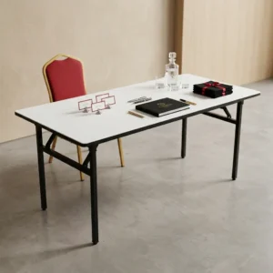 1.8M Events Foldable Table with white rectangular tabletop, black metallic-toned four-leg folding frame and hinged support braces beneath the table