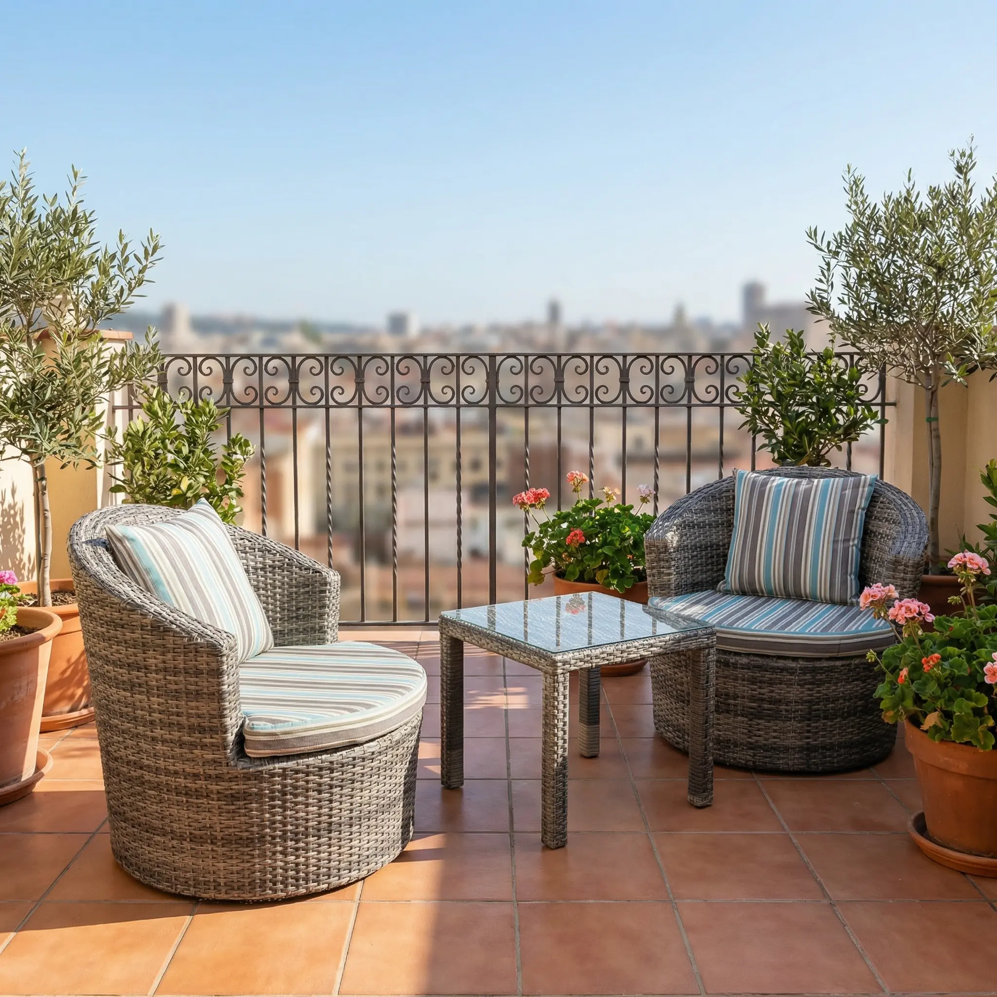 Stylish Outdoor Conversation Set With Two Grey Woven-Style Rounded Armchairs, Striped Green And Blue Cushions, And Coordinating Rectangular Table