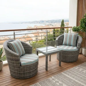 Stylish Outdoor Conversation Set with two grey woven-style rounded armchairs, striped green and blue cushions, and coordinating rectangular table