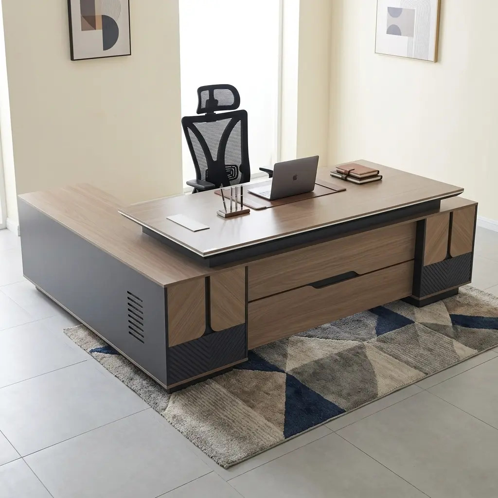 Directors 2.4M Office Desk Featuring An L-Shaped Wooden Executive Workstation With A Light Timber Grain Veneer Top, Matte Charcoal Gray Side Panels, And Geometric Chevron-Milled Base Accents.