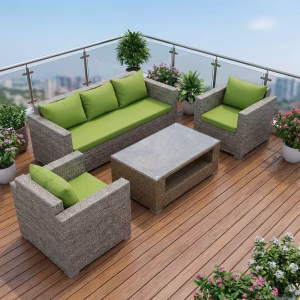 Outdoor Rattan Sofa Set with green cushions and matching coffee table on a modern balcony setting