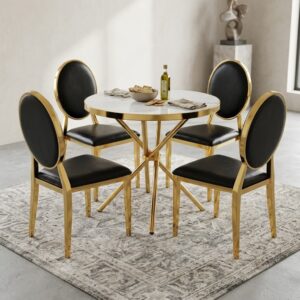 🥂 Glam Gold Faux Marble Dining Set showcasing a round white faux marble dining table with a polished gold stainless steel cross-legged frame paired with four matching gold metal chairs featuring round oval backrests and black faux leather upholstered cushions.