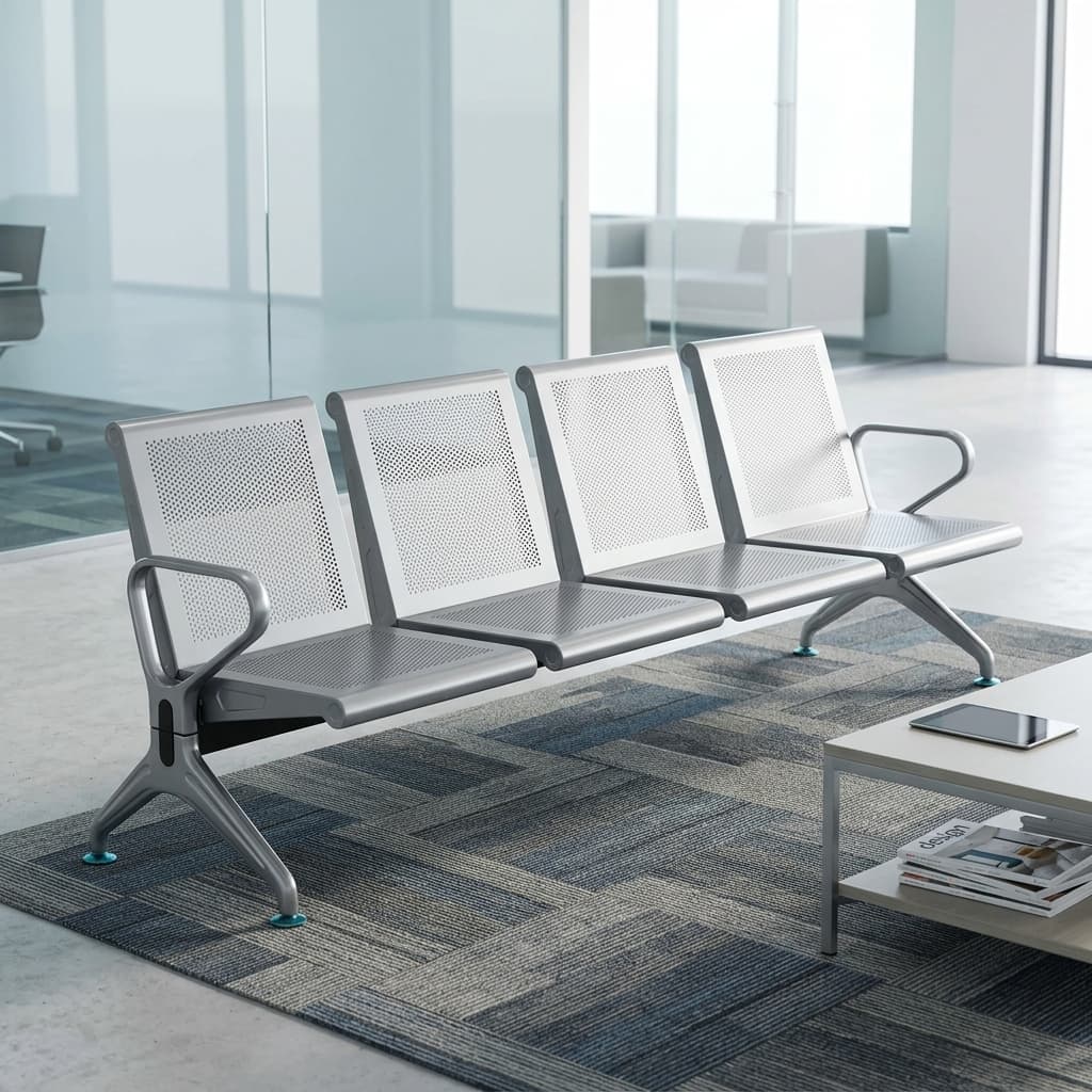 Heavy Duty 4 Seater Waiting Bench Showcasing A Four-Seat Row Made From Micro-Perforated Metallic Silver Stainless Steel Panels With Integrated Steel End Armrests.