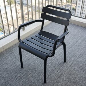 Stackable Plastic Dining Armchair showcasing a molded black polypropylene frame, a curved slatted backrest and seat pan with horizontal planks, and integrated loop armrests.