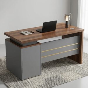 1.2m Executive Office Desk with a rectangular wood-grain desktop, layered top, three handled drawers, lockable upper drawer, circular cable-management grommet, dark grey modesty panel and two gold-toned accent lines