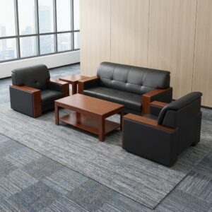 Executive Leather Sofa Set comprising one black leather three-seater sofa and two matching single armchairs with padded seats, stitched backrests and warm brown wooden side panels.