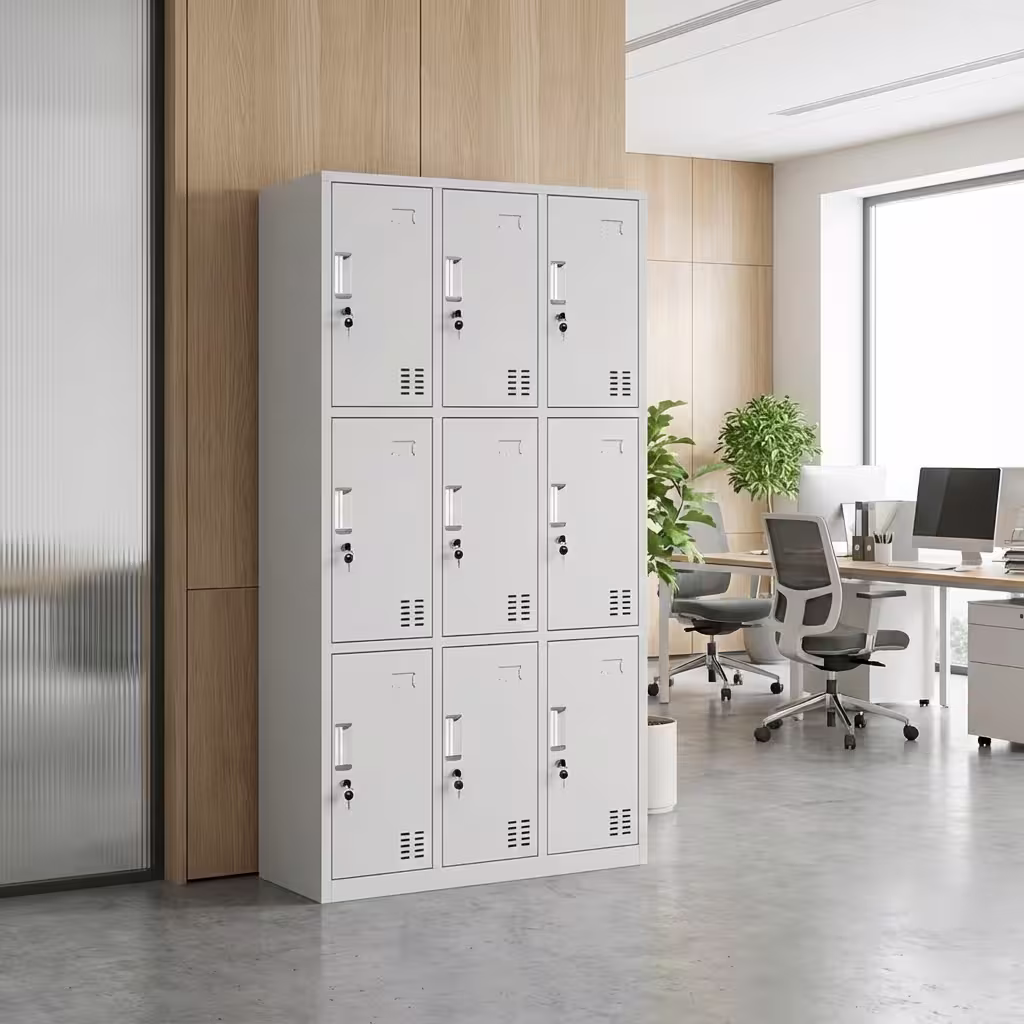 9-Compartment Steel Personnel Locker - Light Grey Multi-Tier Metal Storage Cabinet With Individual Keyed Locks And Ventilated Doors In A Modern Interior Setting.