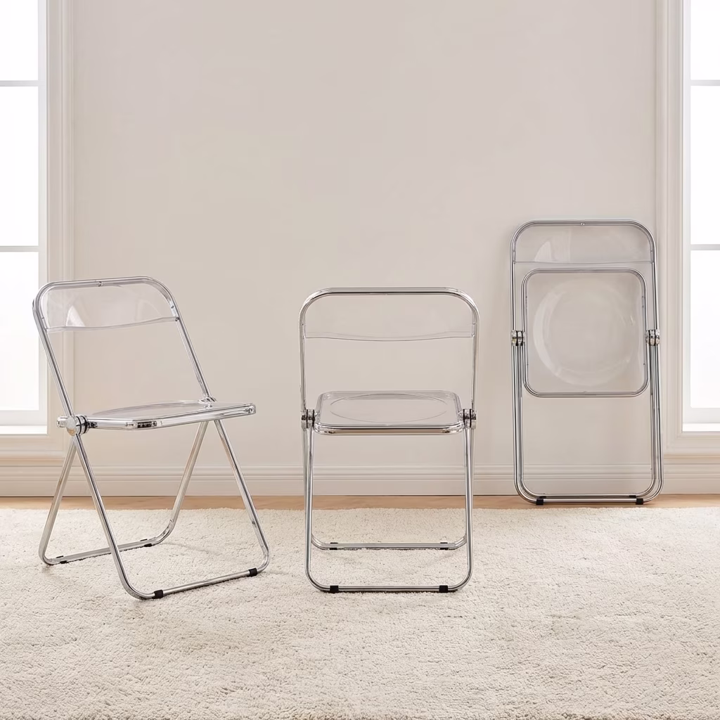 A Clear Acrylic Folding Chair Featuring A Transparent Plastic Seat And Backrest With A Shiny Polished Chrome Metal Folding Frame.