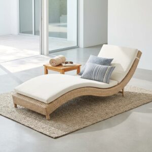 Woven Rattan Sun Lounger with ergonomic curved design and matching side table for poolside and outdoor relaxation