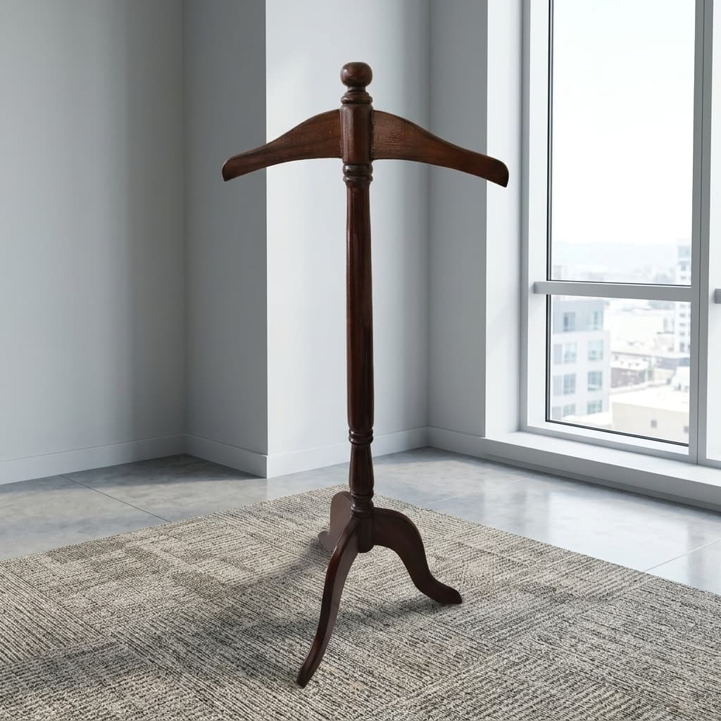A Freestanding Wooden Executive Coat Hanger Valet Stand With A Rich Walnut Finish, A Contoured Shoulder-Shaped Top Hanger, And A Three-Legged Tripod Base.