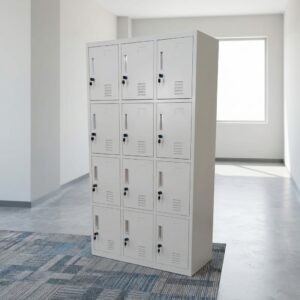 A tall freestanding light gray 12-Door Metal Staff Storage Lockers unit arranged in a 3x4 layout, showing individual key locks, label slots, and ventilation vents on every door.