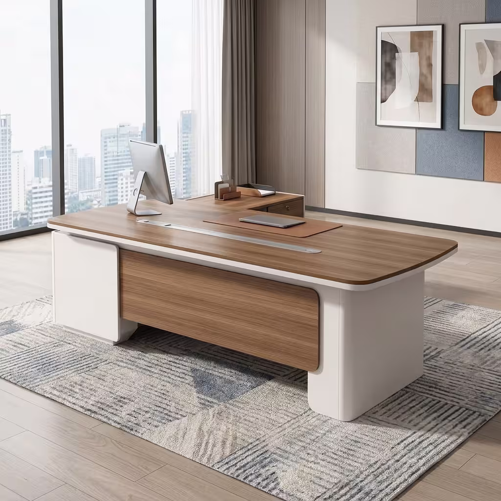 An L-Shaped 2.4M Modern Ceo Desk Featuring A Light Brown Wood Top With Rounded Corners, A Long Silver Cable Management Strip, And Smooth Cream-Colored Base Legs With A Matching Locking Side Return Unit.