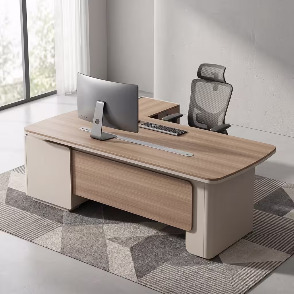 An L-Shaped 2.4M Modern Ceo Desk Featuring A Light Brown Wood Top With Rounded Corners, A Long Silver Cable Management Strip, And Smooth Cream-Colored Base Legs With A Matching Locking Side Return Unit.