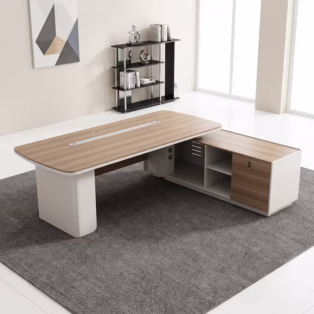 An L-Shaped 2.4M Modern Ceo Desk Featuring A Light Brown Wood Top With Rounded Corners, A Long Silver Cable Management Strip, And Smooth Cream-Colored Base Legs With A Matching Locking Side Return Unit.