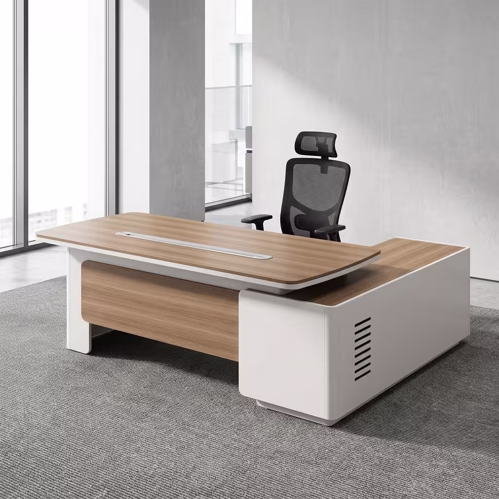 An L-Shaped 2.4M Modern Ceo Desk Featuring A Light Brown Wood Top With Rounded Corners, A Long Silver Cable Management Strip, And Smooth Cream-Colored Base Legs With A Matching Locking Side Return Unit.