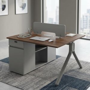 Dual Office Workstation Desk featuring a double-sided walnut wood-grain desktop, a central gray privacy screen divider, and a dial combination lock storage pedestal.