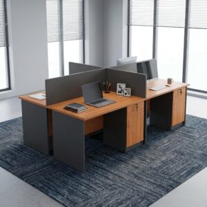 Corporate 4-Person Desk Workstation showcasing a four-desk cross cluster with cherry wood grain desktops, charcoal gray privacy divider screens, and built-in locking storage units with keys.