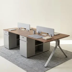 4-Way Office Cluster Workstation with four brown wood-grain work areas, grey-toned integrated drawer and open storage units, and angled metallic-toned outer legs