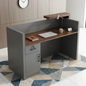 1.6m Contemporary Office Reception Desk featuring a brown wood-grain worktop, grey side panels, raised visitor counter, lockable drawer and storage cabinet.