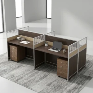 4-Way Partitioned Office Workstation Featuring Dark Wood-Grain Desktops, Metallic-Framed Privacy Partitions With Horizontal Slatted Detailing, And Individual Three-Drawer Storage Pedestals.