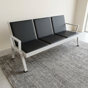 3-Seater Padded Office Waiting Bench featuring three black upholstered cushioned seats, individual padded backrests, white metal frame, angled legs, and integrated armrests on both ends.
